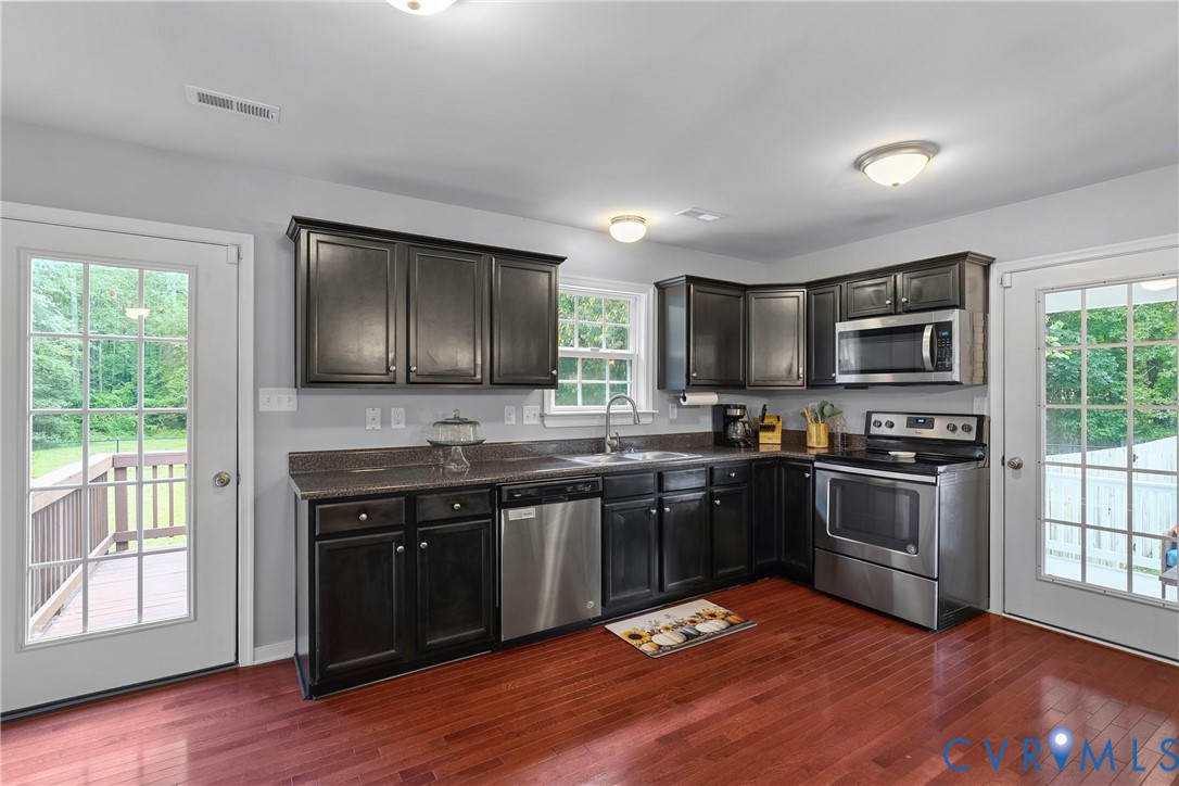 17045 Annfield Road Beaverdam, VA 23015 - Photo 12 of 40 Kitchen featuring wood-finish flooring, dark cabin