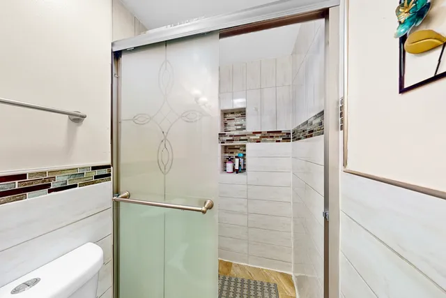 a bathroom with a shower and a sink