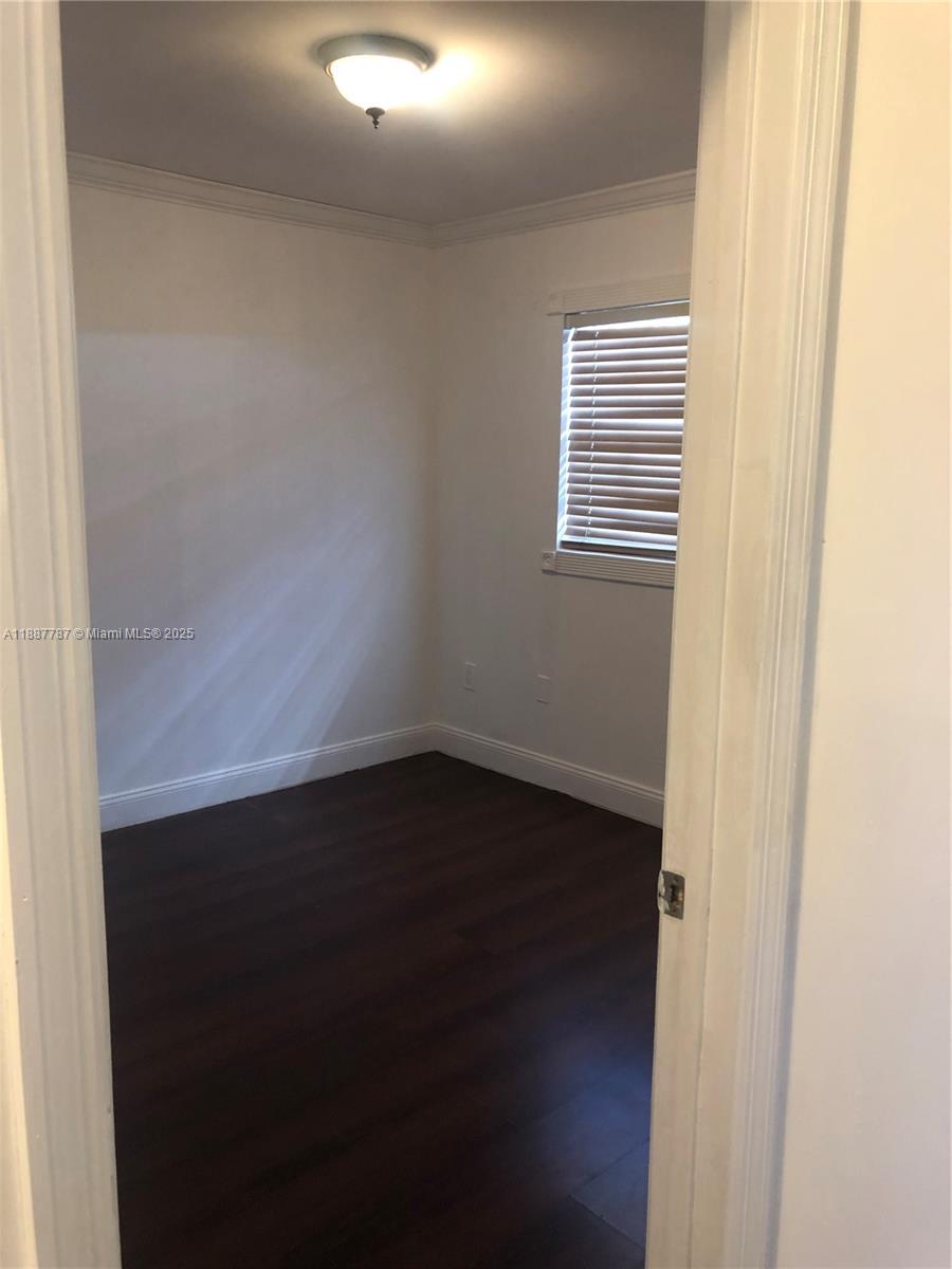 19319 Northwest 54th Court Miami Gardens, FL 33055 - Photo 17 of 20 a view of a small space with wooden floor and a window