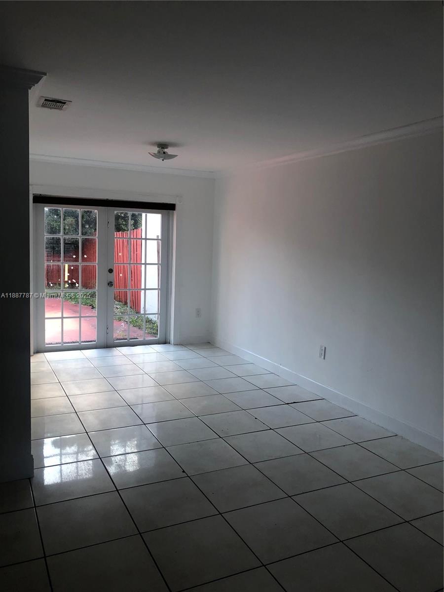 19319 Northwest 54th Court Miami Gardens, FL 33055 - Photo 4 of 20 a view of an empty room with chandelier
