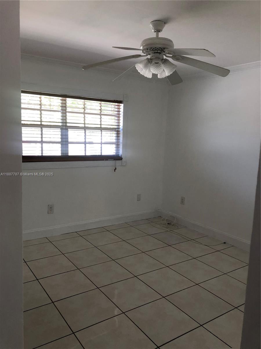 19319 Northwest 54th Court Miami Gardens, FL 33055 - Photo 6 of 20 an empty room with a window