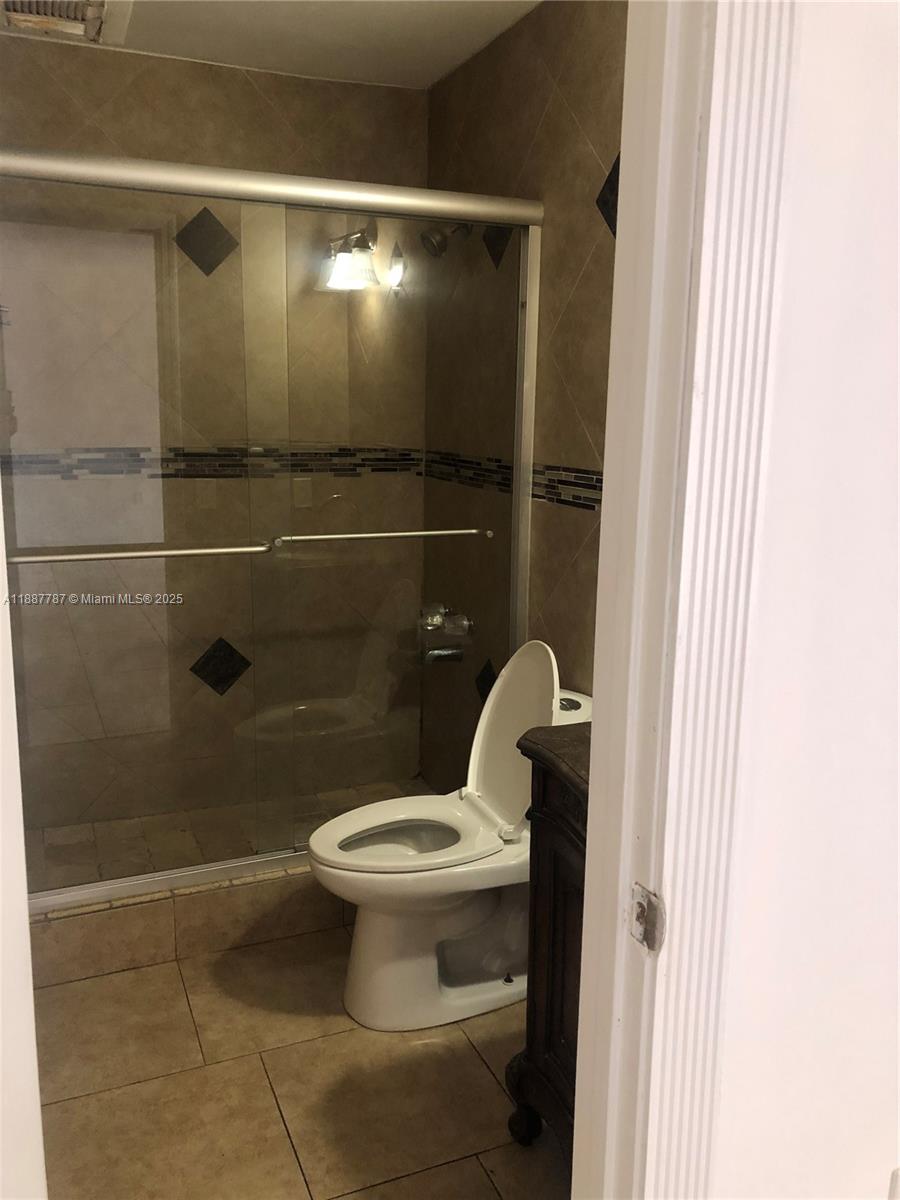 19319 Northwest 54th Court Miami Gardens, FL 33055 - Photo 8 of 20 a bathroom with a toilet and a shower