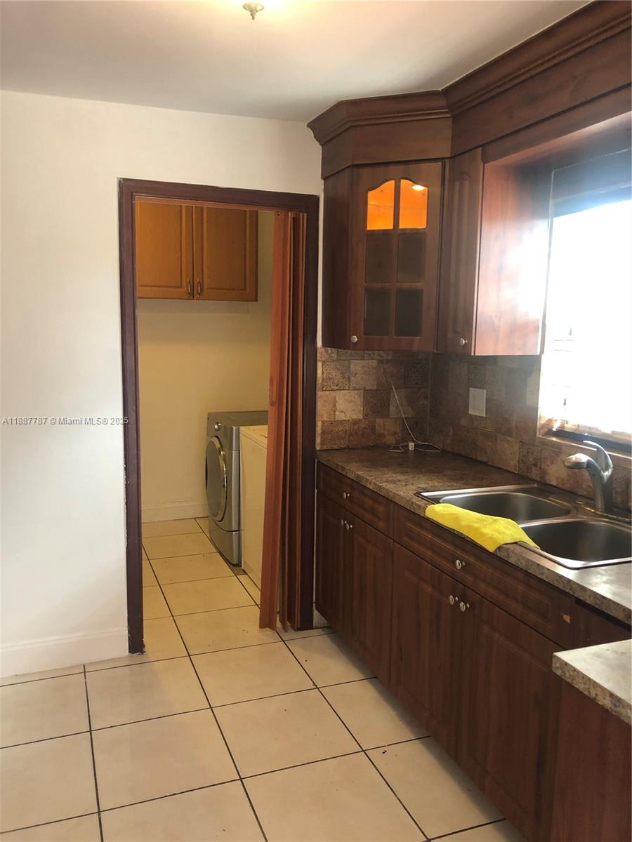 19319 Northwest 54th Court Miami Gardens, FL 33055 - Photo 10 of 20 a bathroom with a granite countertop sink and a tub