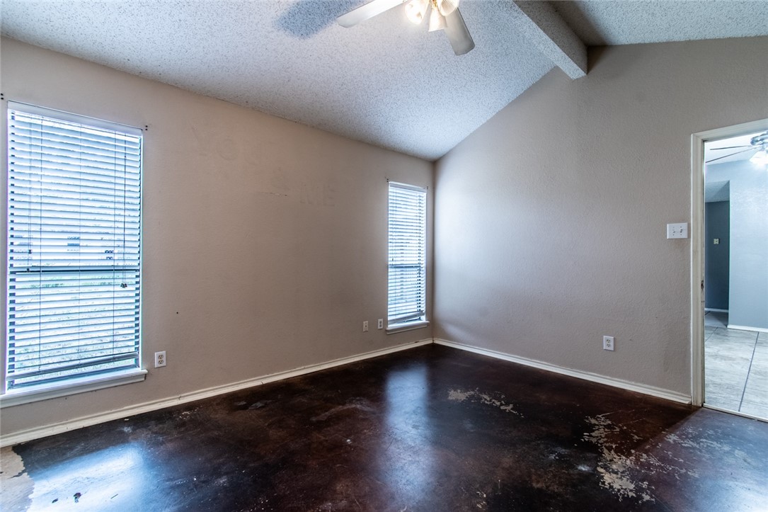 2185 Spring Park Drive Ingleside, TX 78362 - Photo 15 of 32 an empty room with wooden floor and windows