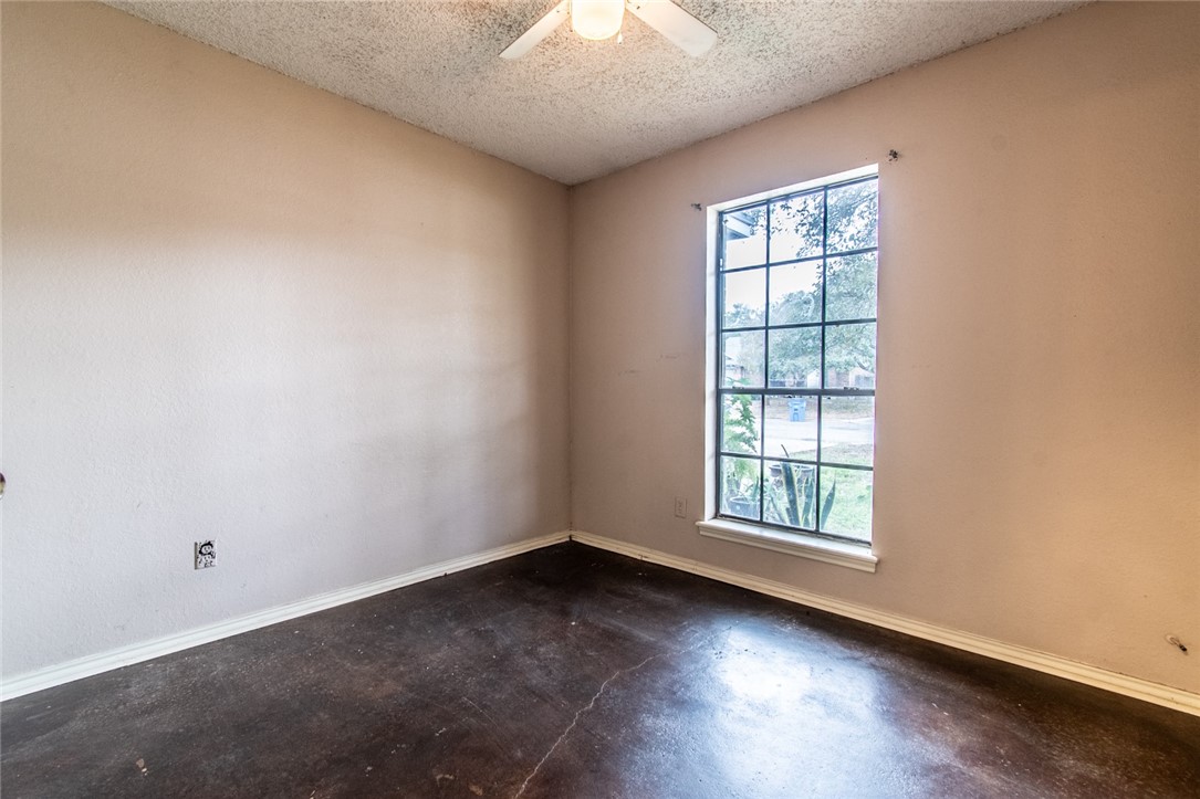 2185 Spring Park Drive Ingleside, TX 78362 - Photo 21 of 32 an empty room with wooden floor and windows