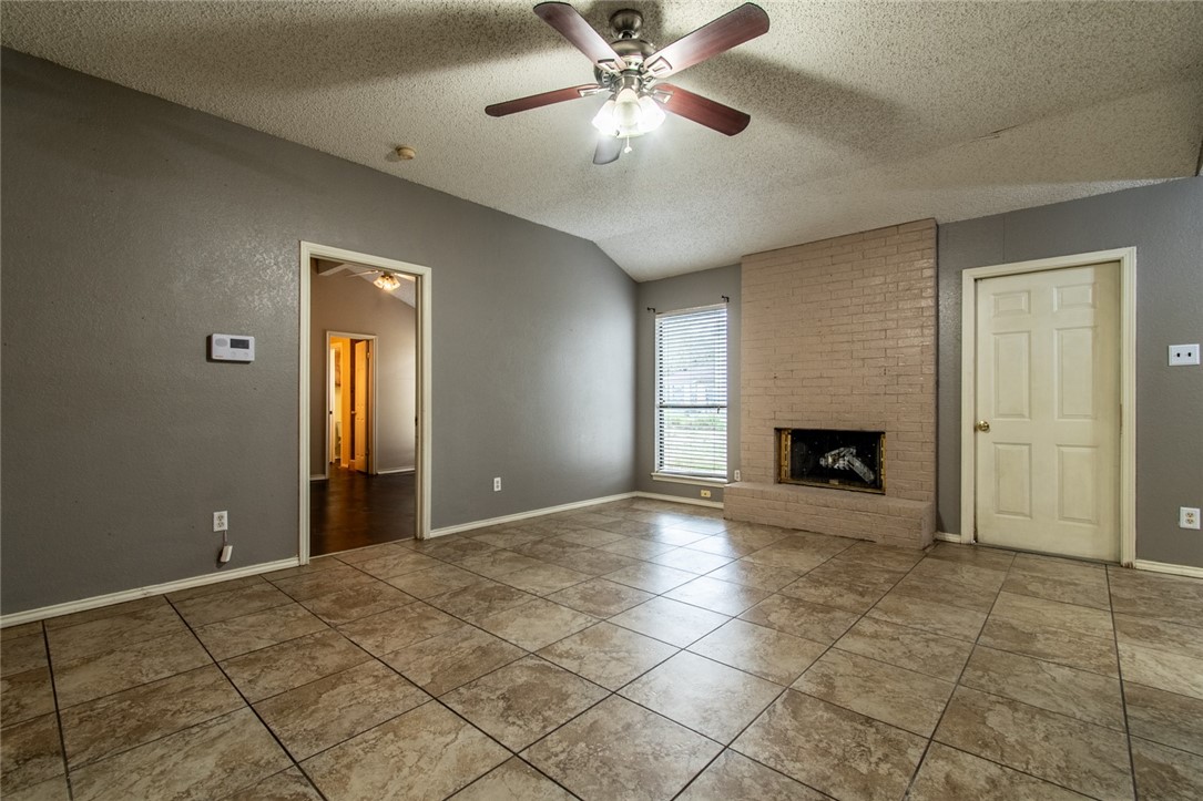 2185 Spring Park Drive Ingleside, TX 78362 - Photo 5 of 32 a view of an empty room with a fireplace