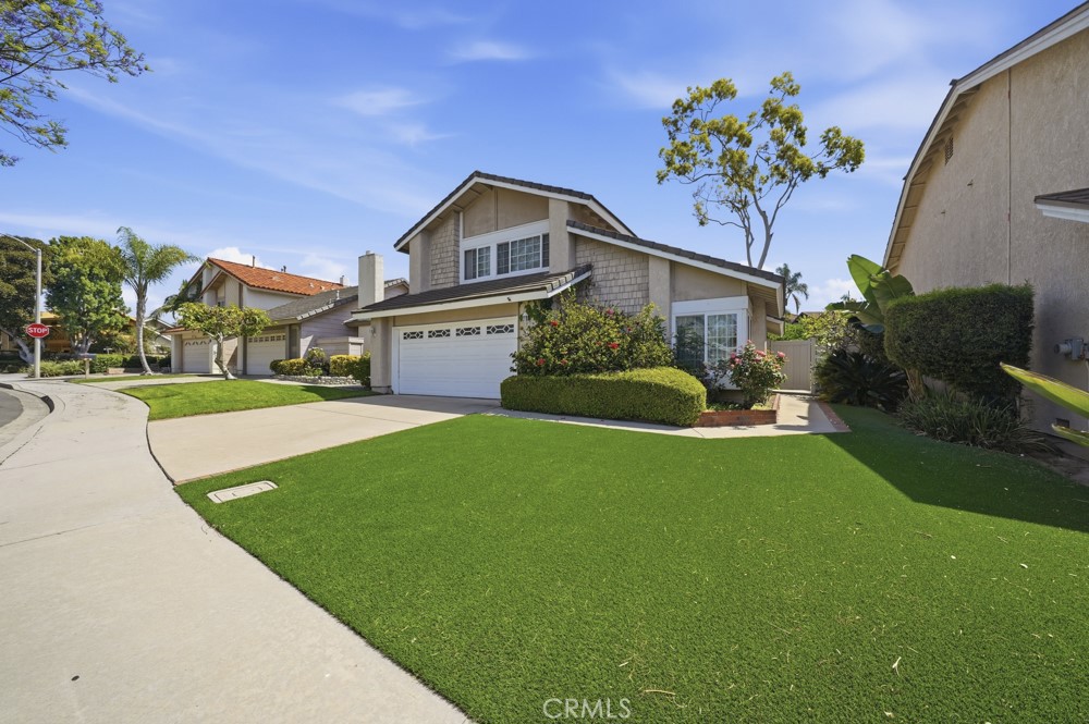 5 Eden Irvine, CA 92620 - Photo 1 of 42 a front view of a house with a yard and potted plants