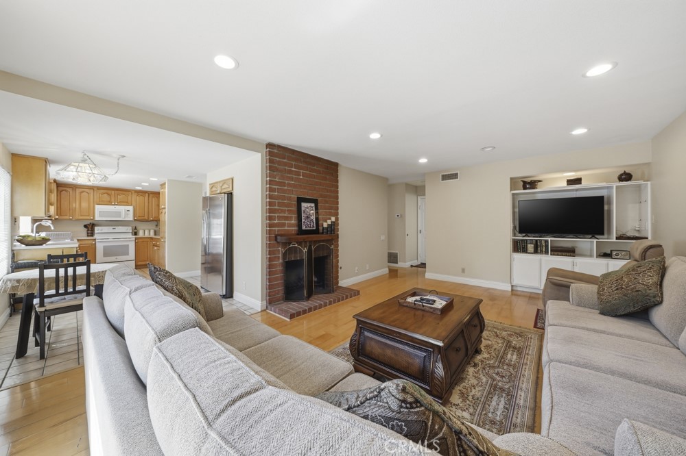 5 Eden Irvine, CA 92620 - Photo 12 of 42 a living room with furniture and a flat screen tv