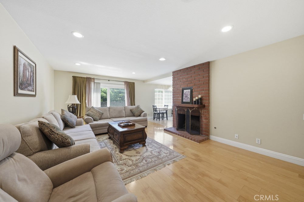 5 Eden Irvine, CA 92620 - Photo 13 of 42 a living room with furniture and a fireplace