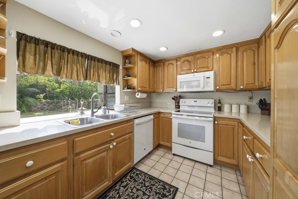 5 Eden Irvine, CA 92620 - Photo 15 of 42 a kitchen with a sink window and cabinets