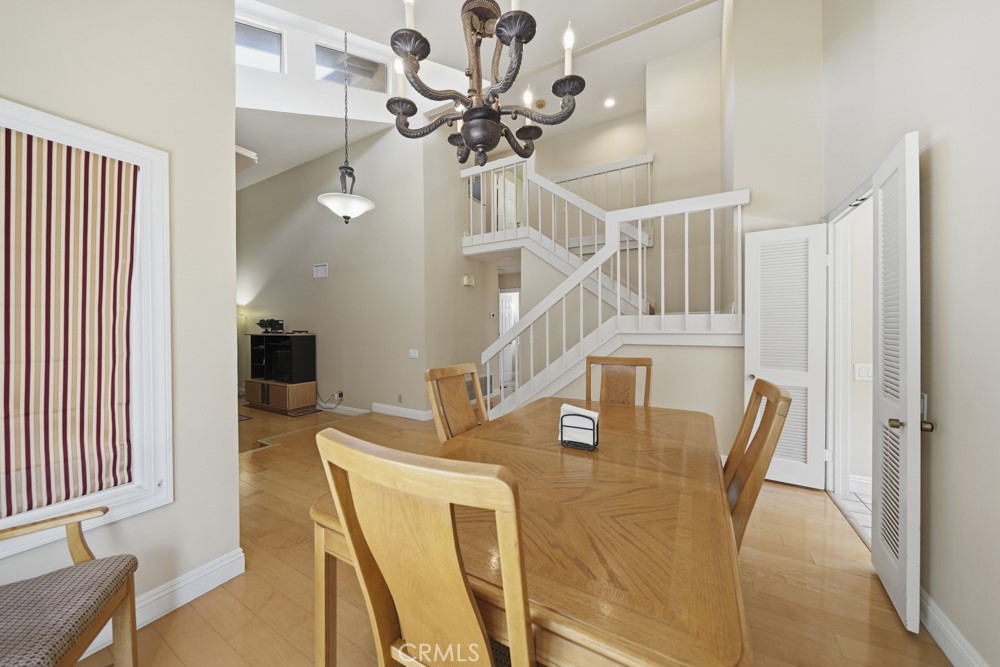 5 Eden Irvine, CA 92620 - Photo 20 of 42 a view of a dining room with furniture and a chandelier