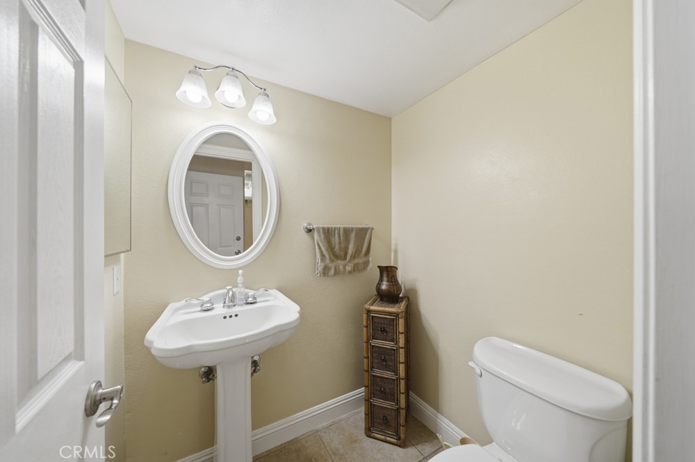 5 Eden Irvine, CA 92620 - Photo 22 of 42 a bathroom with a sink toilet and a mirror