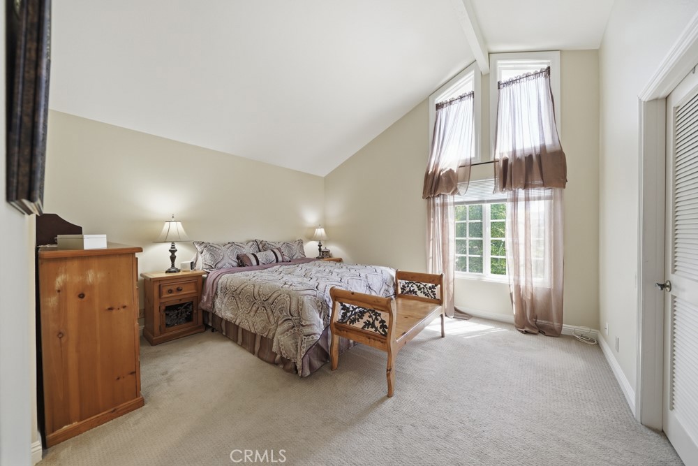 5 Eden Irvine, CA 92620 - Photo 23 of 42 a spacious bedroom with a bed and wooden floor