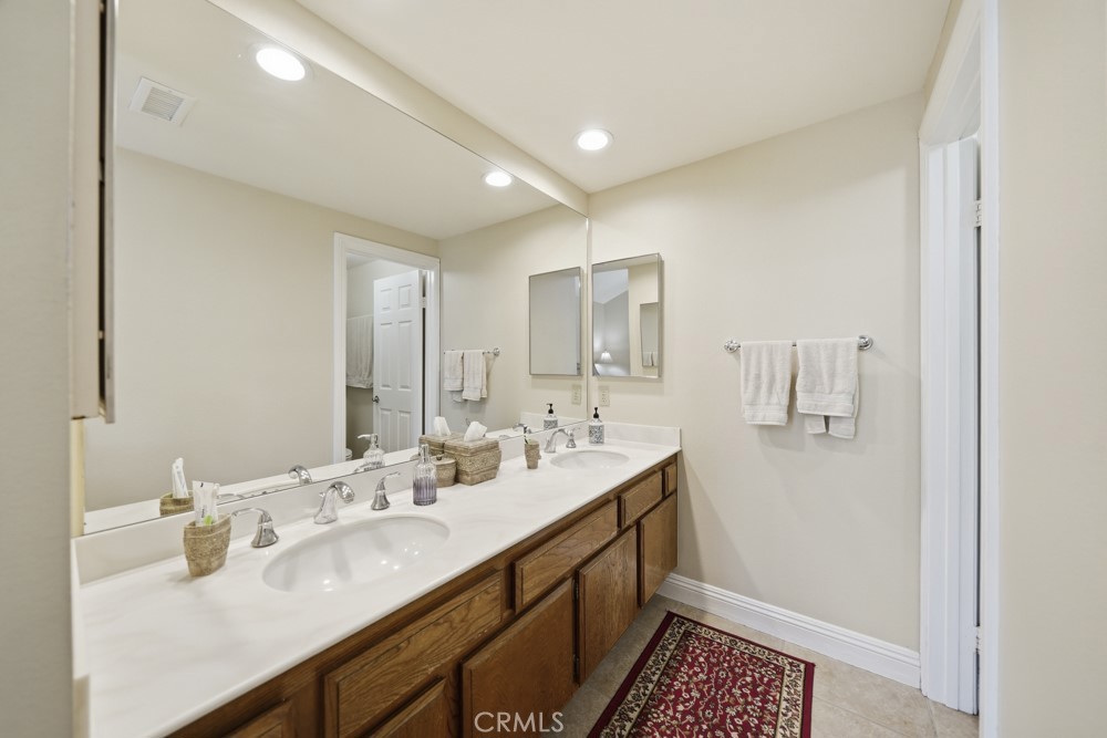 5 Eden Irvine, CA 92620 - Photo 25 of 42 a bathroom with a sink double vanity and a mirror