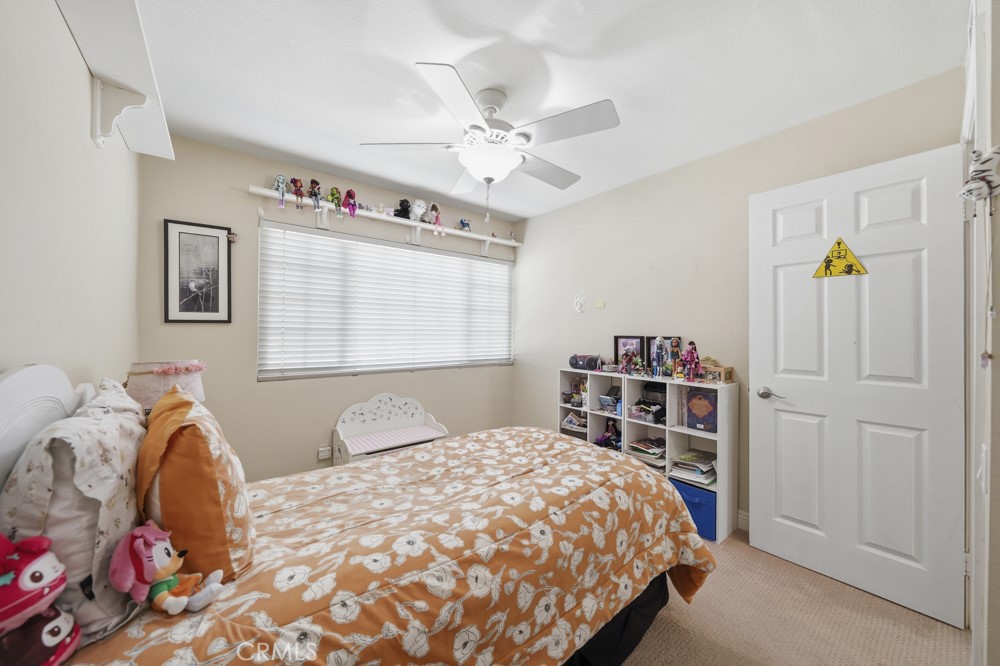 5 Eden Irvine, CA 92620 - Photo 27 of 42 a bedroom with a large bed and a window