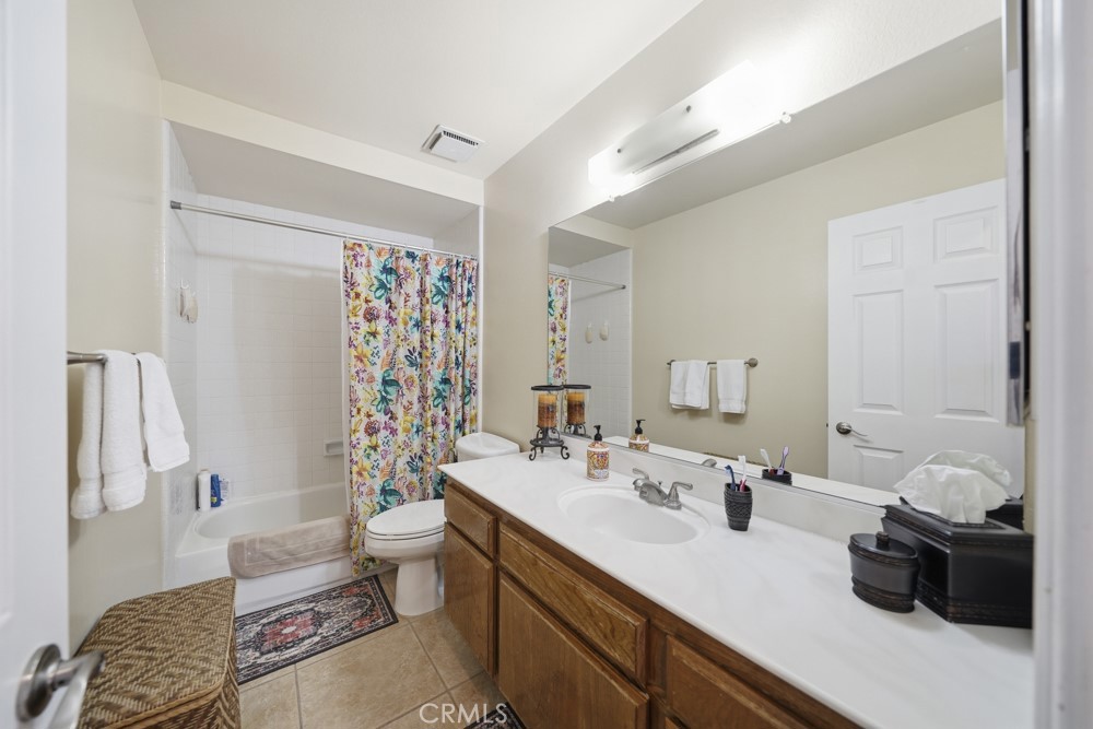 5 Eden Irvine, CA 92620 - Photo 28 of 42 a bathroom with a sink a toilet and shower