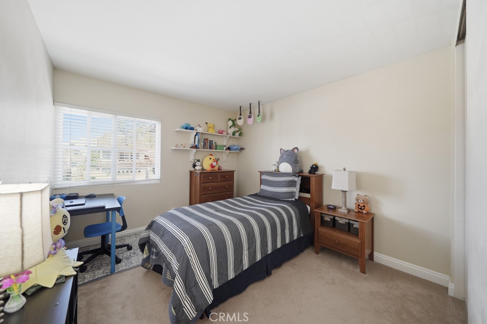 5 Eden Irvine, CA 92620 - Photo 29 of 42 a bedroom with a bed and a window
