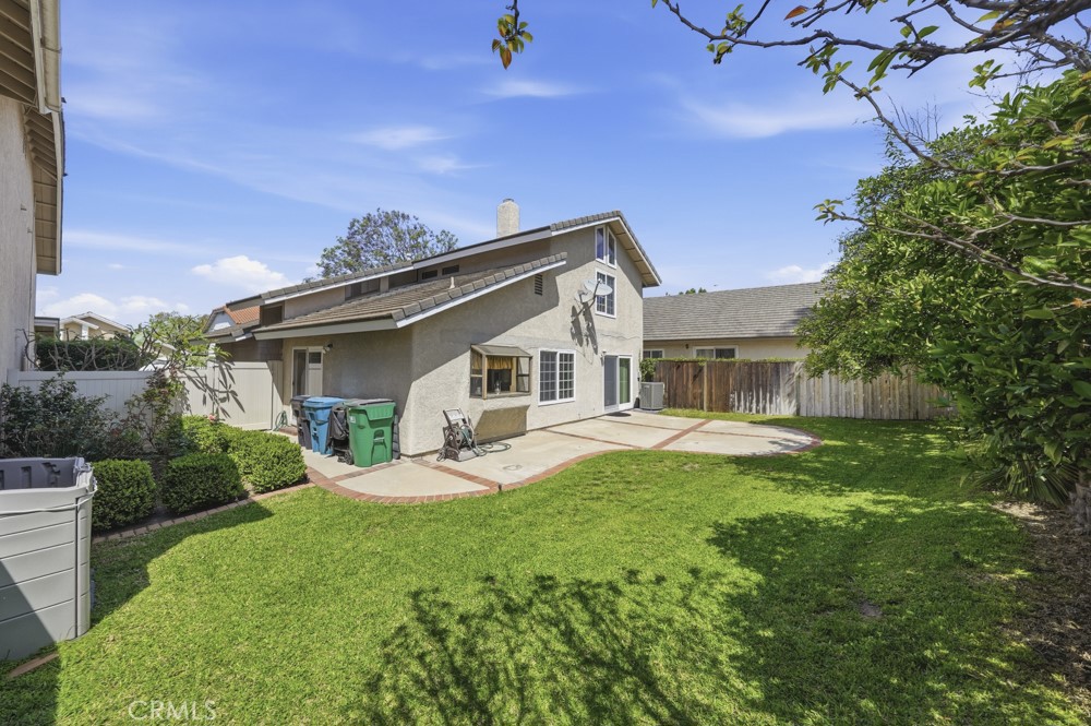 5 Eden Irvine, CA 92620 - Photo 31 of 42 a front view of a house with garden and porch