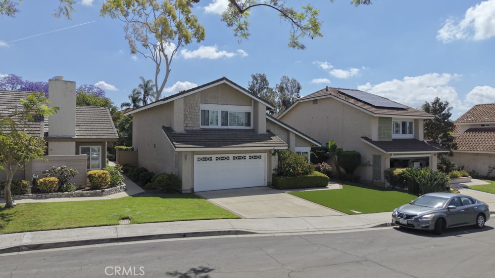 5 Eden Irvine, CA 92620 - Photo 35 of 42 a front view of a house with a yard and garage
