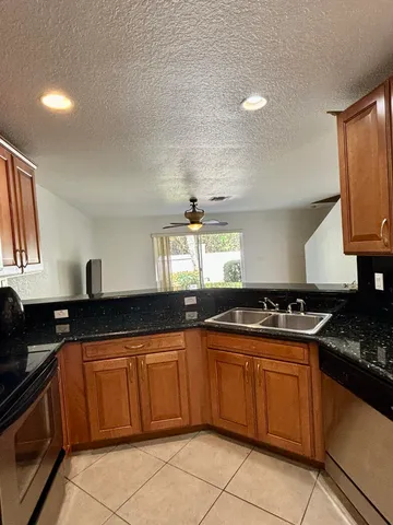 a lobby with furniture and flat screen tv