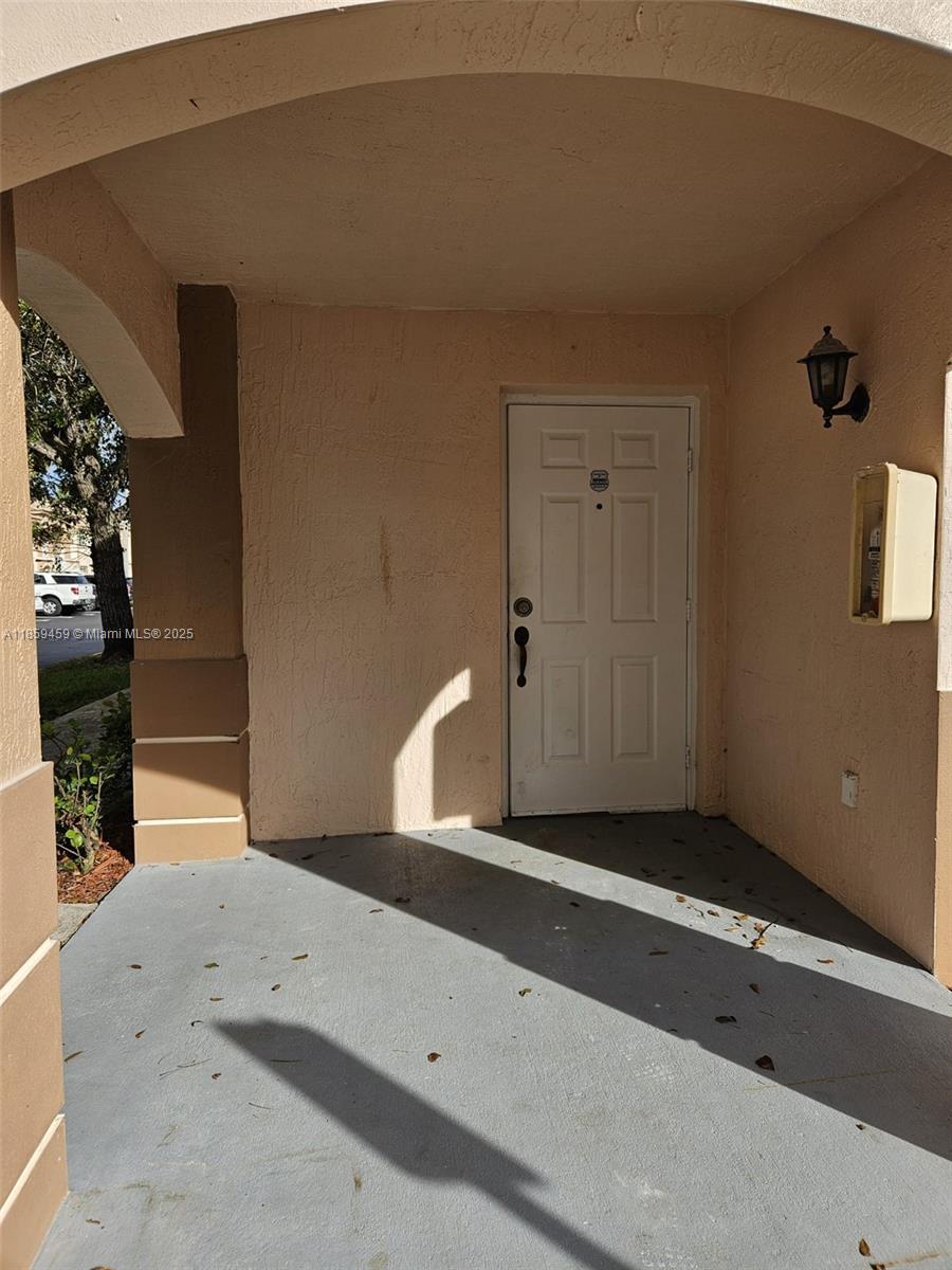 2701 Southeast 12th Road, Unit 101 Homestead, FL 33035 - Photo 2 of 5 a view of a livingroom with wooden floor