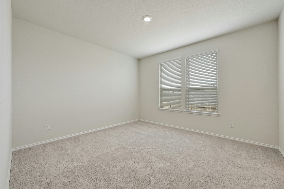 529 Tree Nut Loop Buda, TX 78610 - Photo 14 of 37 an empty room with a window