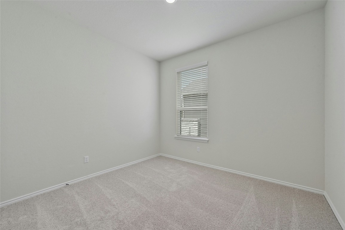 529 Tree Nut Loop Buda, TX 78610 - Photo 21 of 37 a view of an empty room with a window
