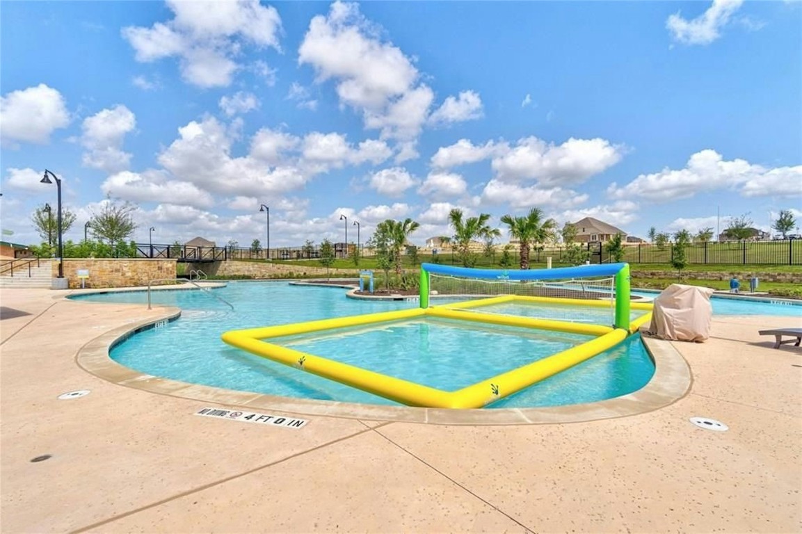 529 Tree Nut Loop Buda, TX 78610 - Photo 32 of 37 a view of a swimming pool and an outdoor space