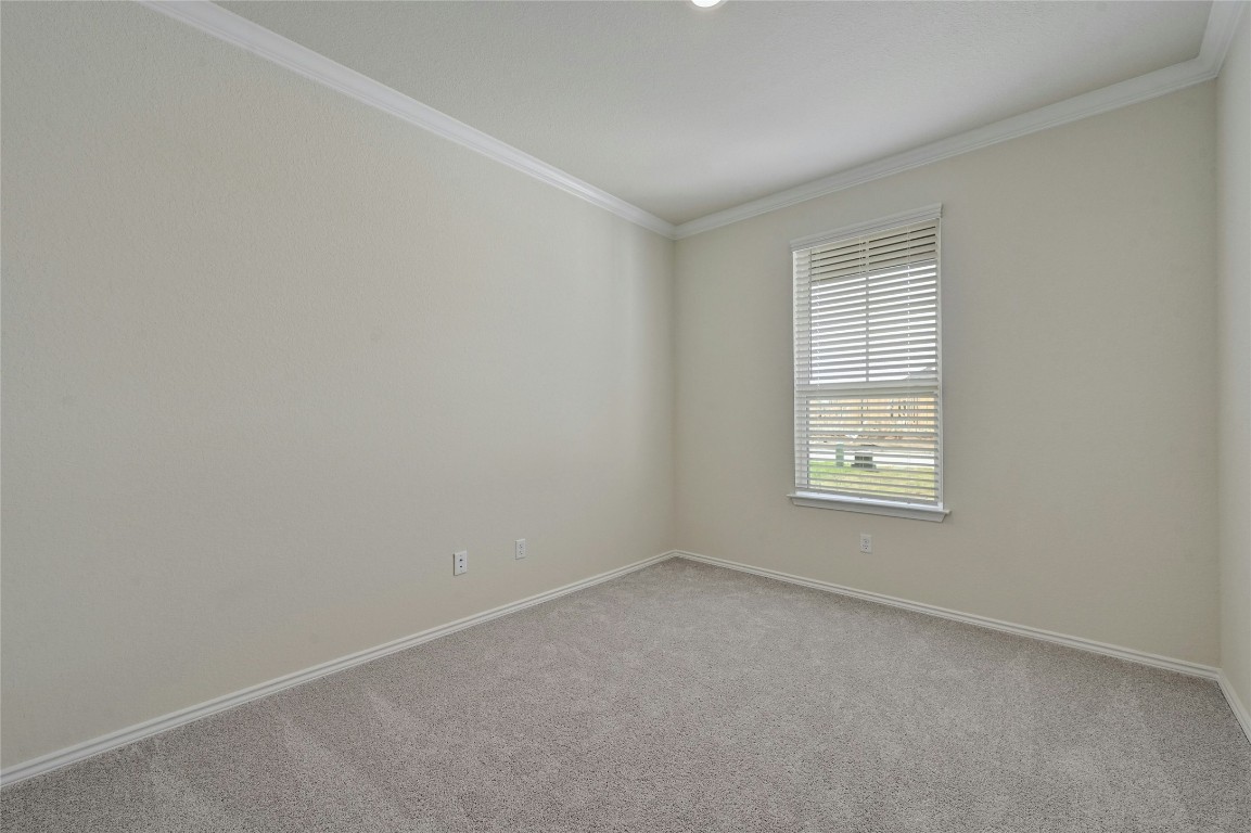 529 Tree Nut Loop Buda, TX 78610 - Photo 6 of 37 an empty room with a window