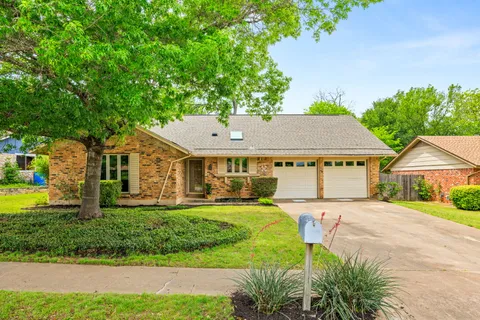 front view of a house with a big yard