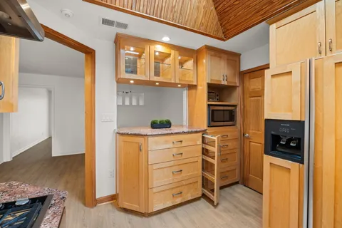 a kitchen with stainless steel appliances a stove and a refrigerator