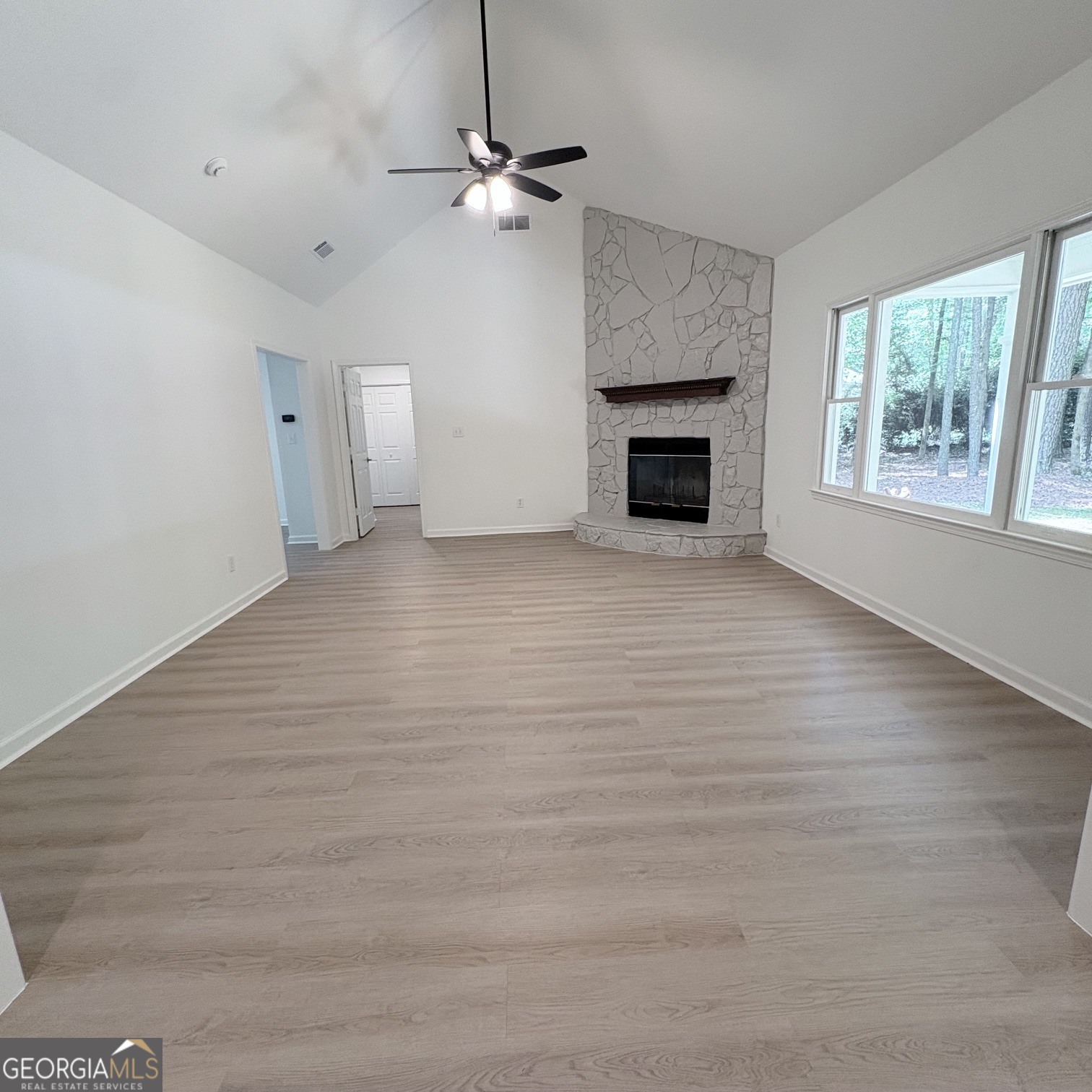 190 Rockington Drive Tyrone, GA 30290 - Photo 25 of 54 a view of an empty room with a fireplace and a window