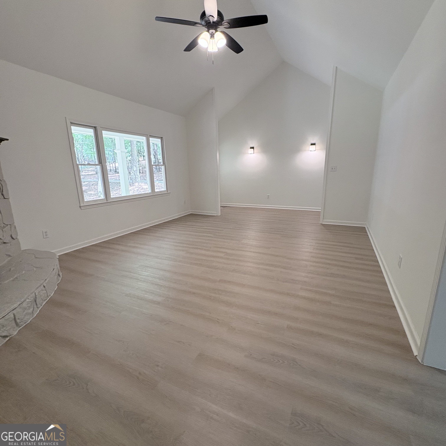 190 Rockington Drive Tyrone, GA 30290 - Photo 26 of 54 an empty room with wooden floor fan and windows