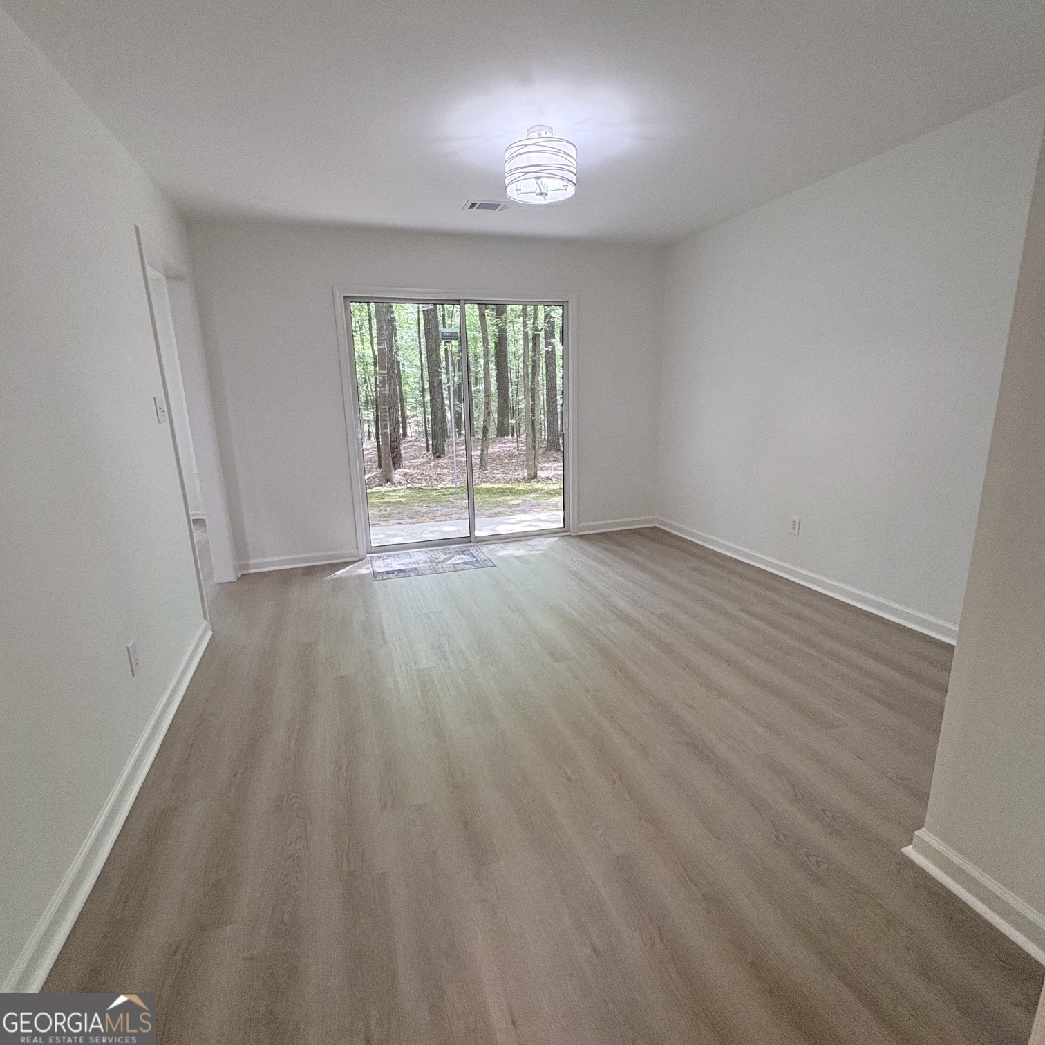 190 Rockington Drive Tyrone, GA 30290 - Photo 27 of 54 wooden floor in an empty room with a window