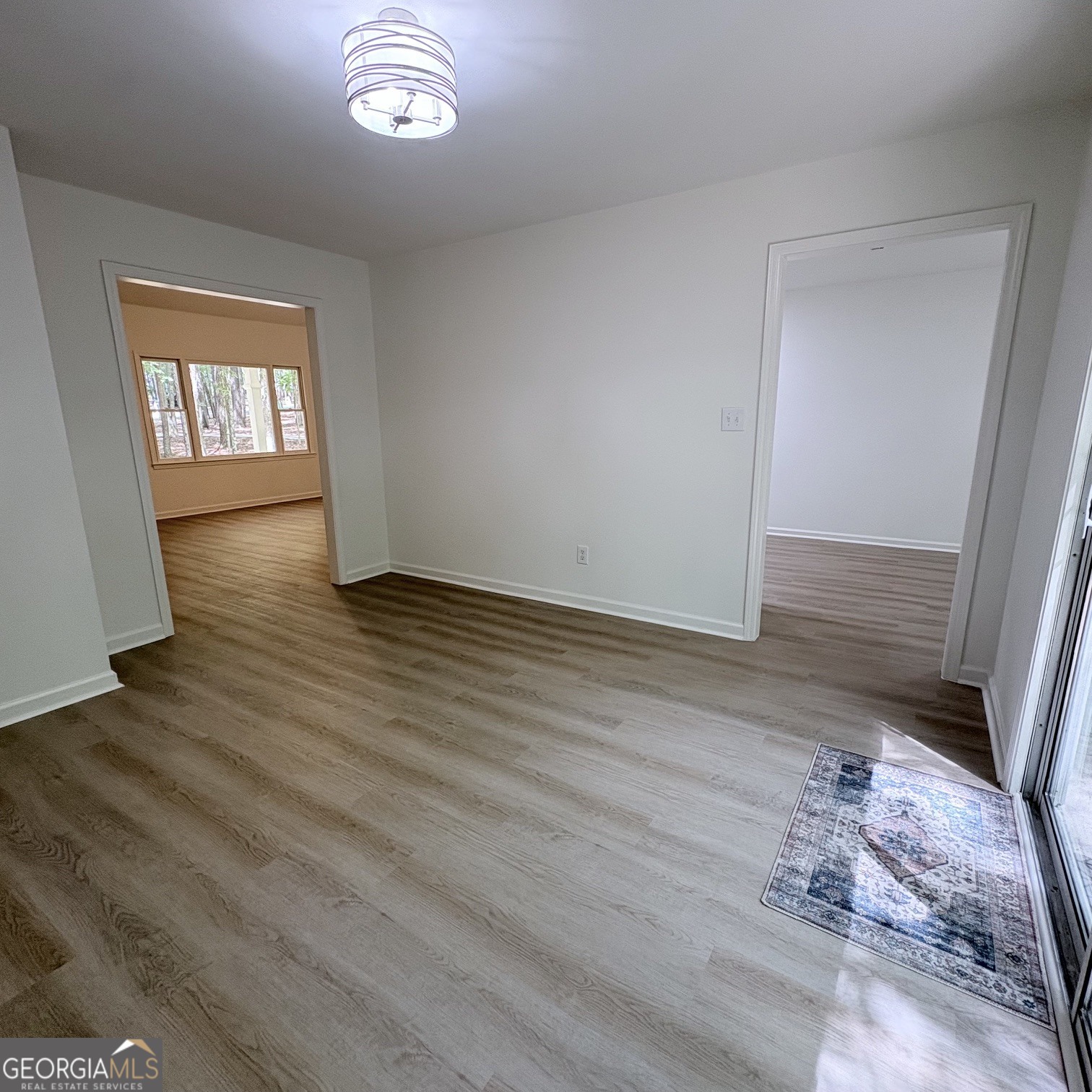190 Rockington Drive Tyrone, GA 30290 - Photo 28 of 54 a view of an empty room with wooden floor and a window