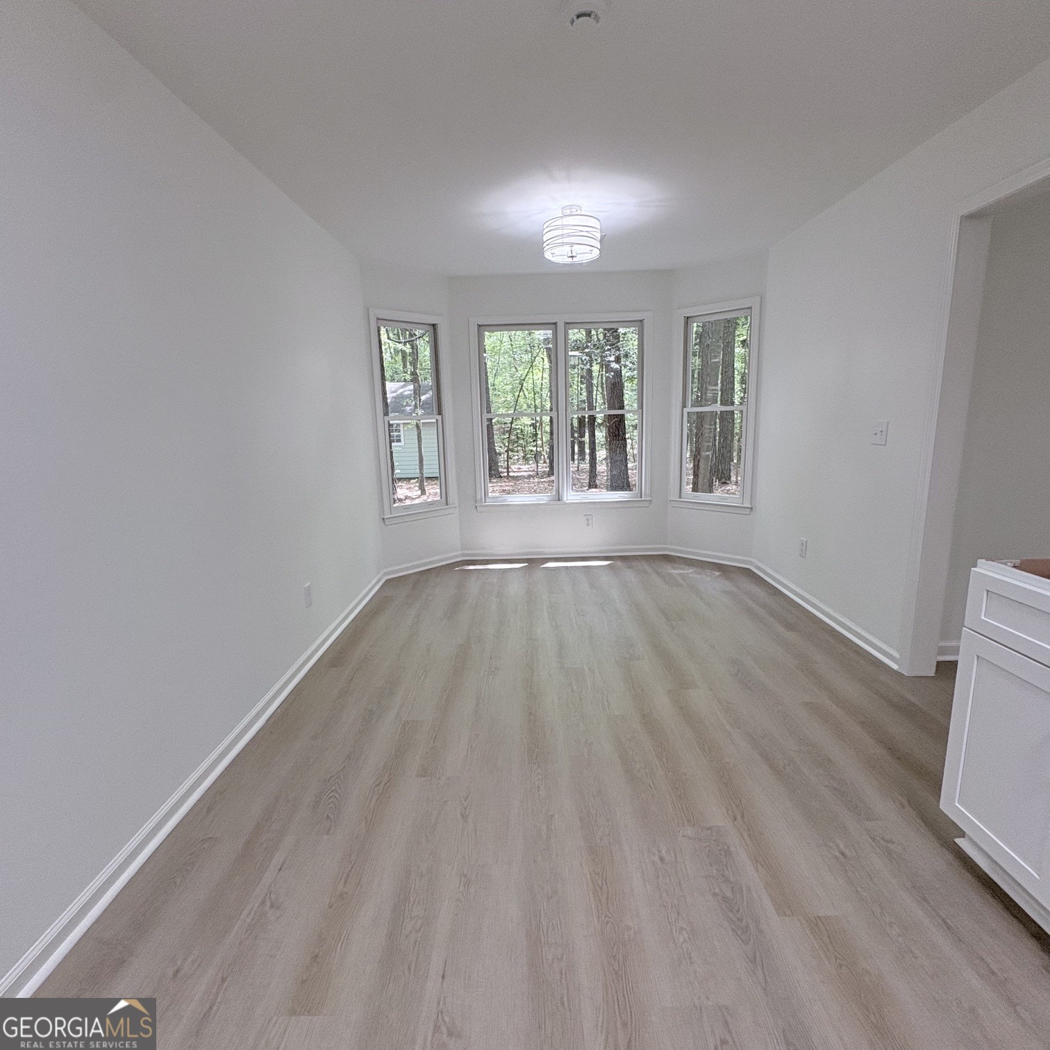 190 Rockington Drive Tyrone, GA 30290 - Photo 29 of 54 wooden floor in an empty room with a window