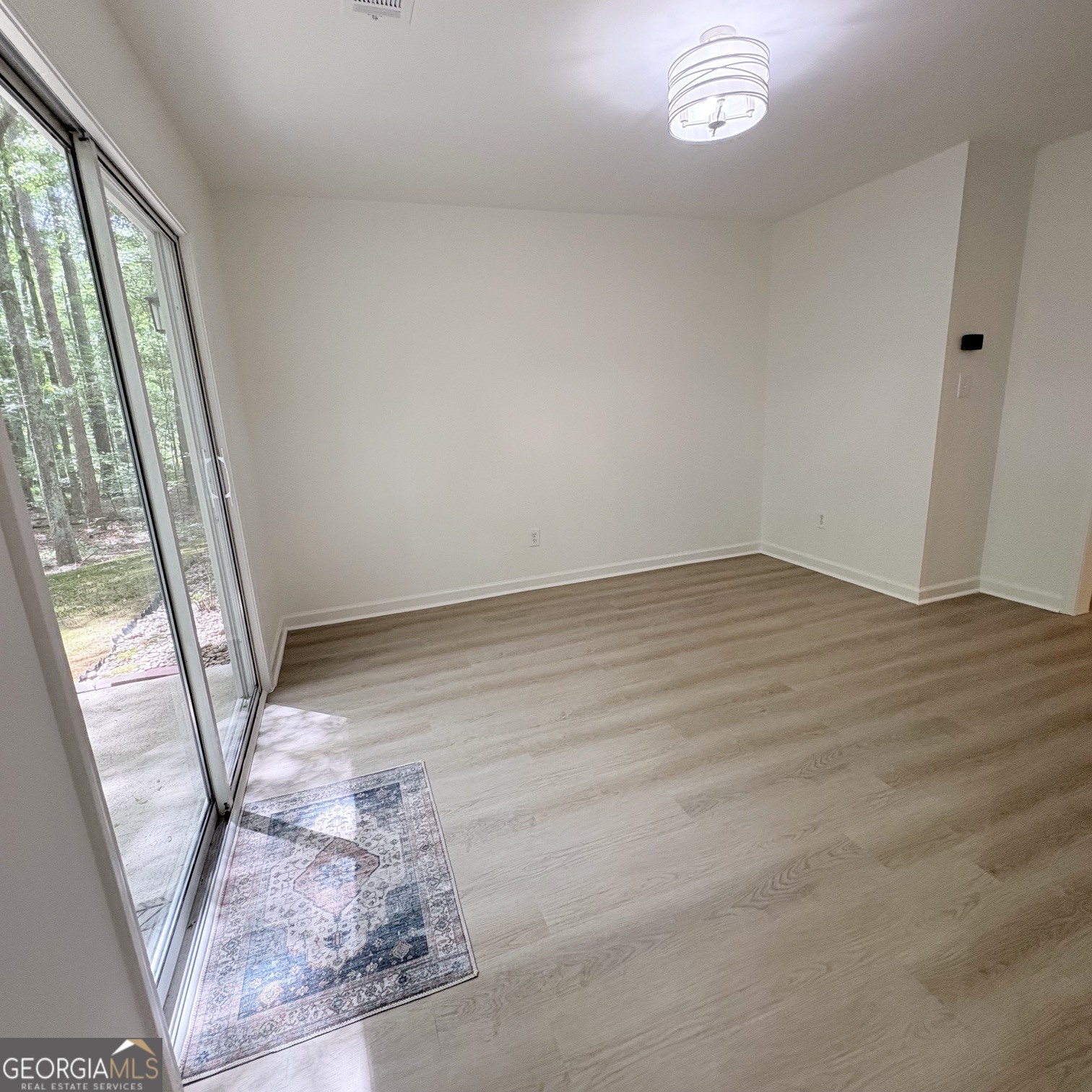 190 Rockington Drive Tyrone, GA 30290 - Photo 37 of 54 a view of a livingroom with wooden floor and window