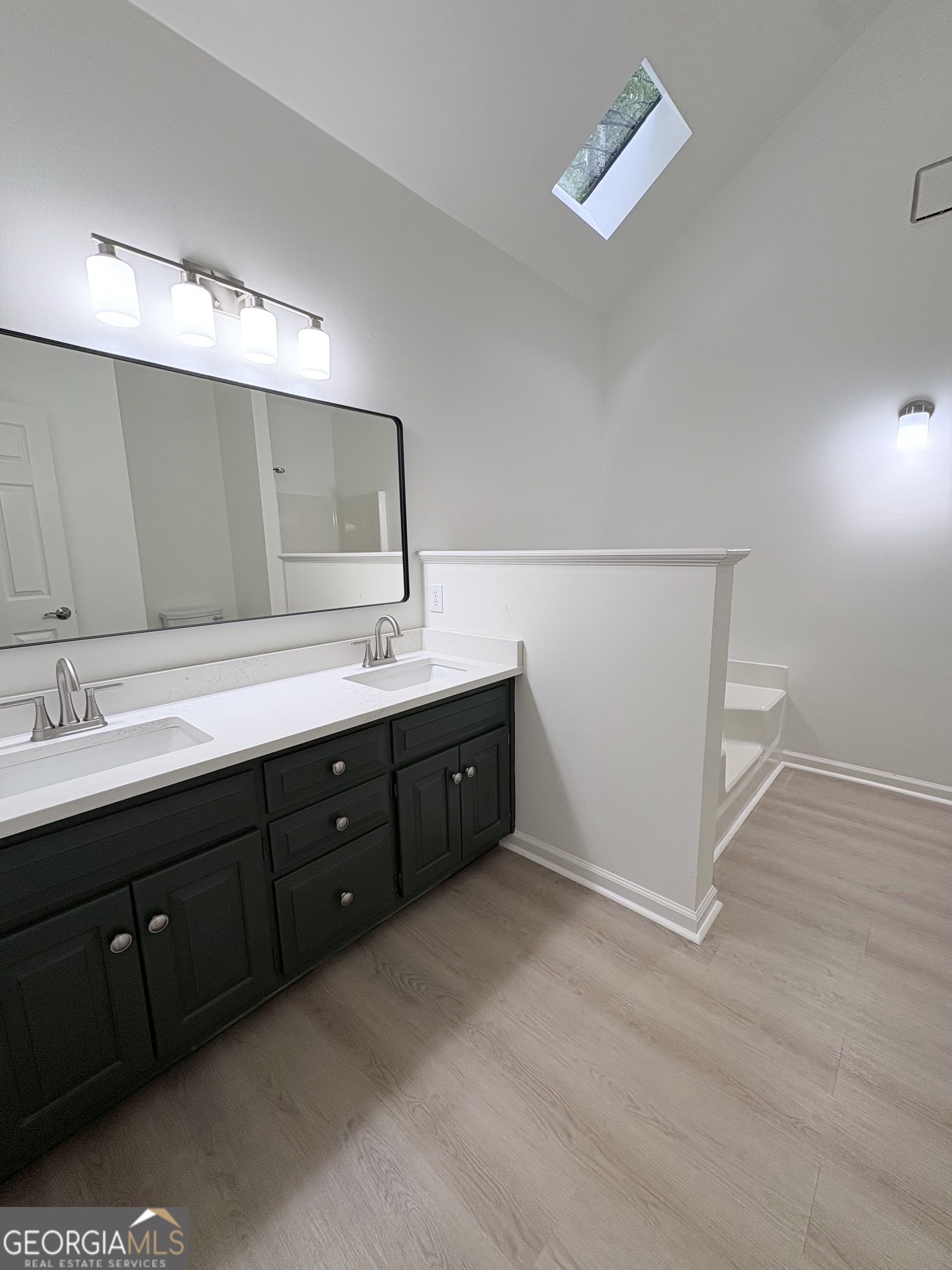 190 Rockington Drive Tyrone, GA 30290 - Photo 40 of 54 a spacious bathroom with a double vanity sink and a mirror