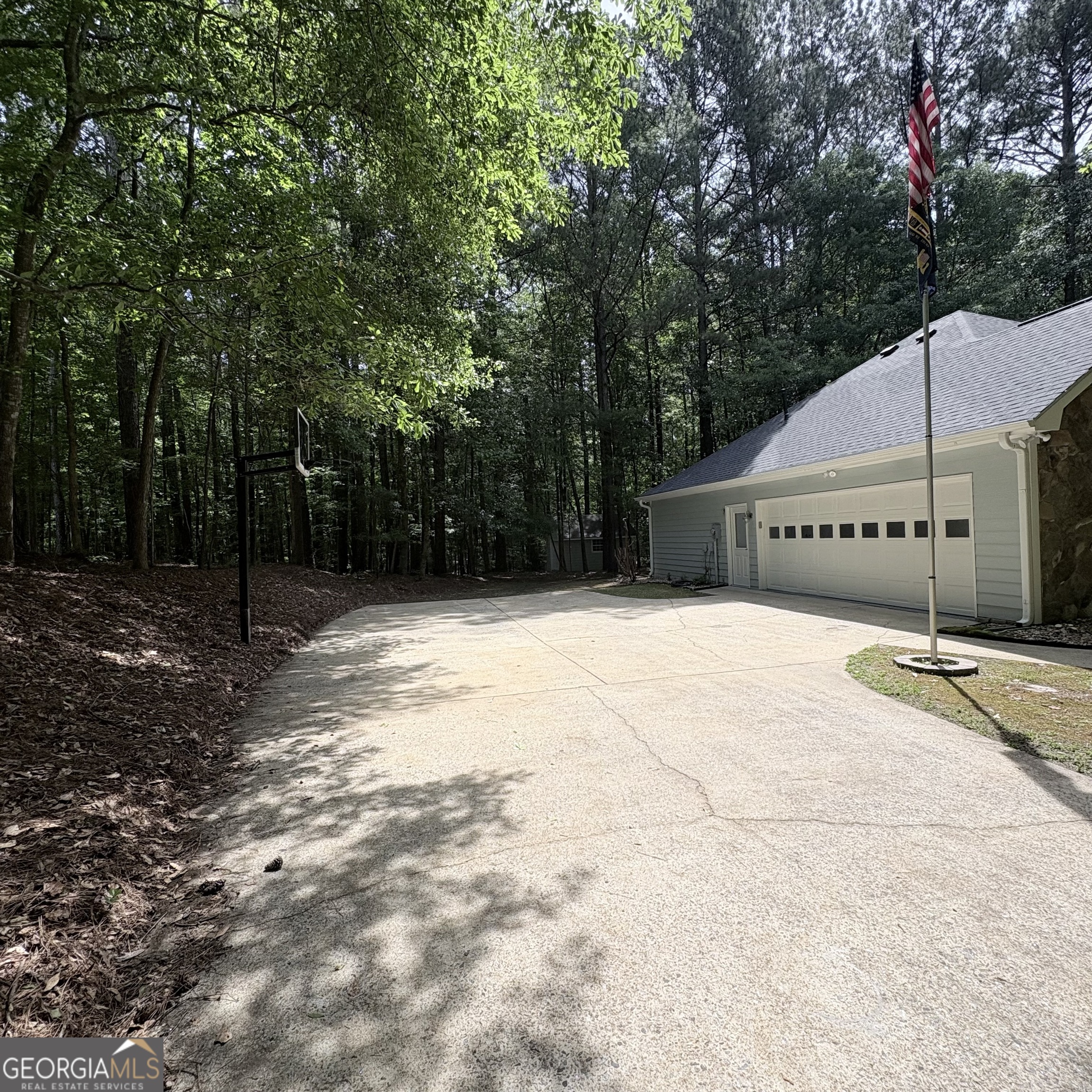 190 Rockington Drive Tyrone, GA 30290 - Photo 4 of 54 a backyard of a house with large trees
