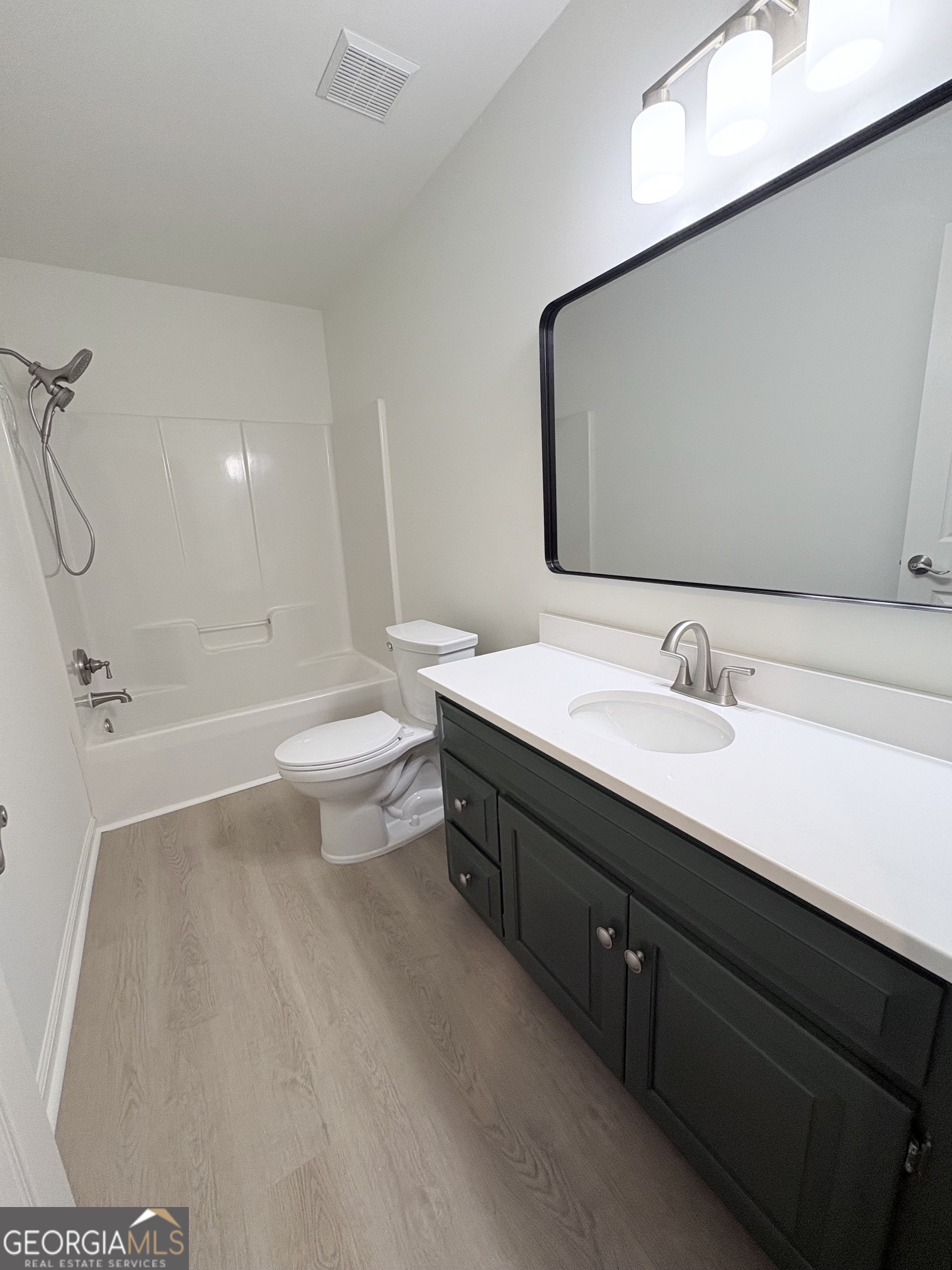 190 Rockington Drive Tyrone, GA 30290 - Photo 48 of 54 a bathroom with a double vanity sink toilet and shower