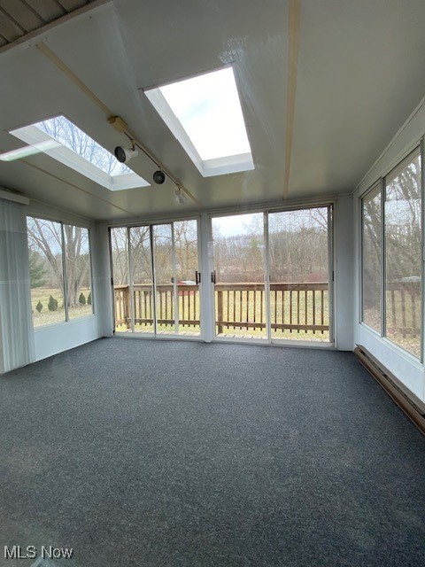 2868 Pressler Road Uniontown, OH 44685 - Photo 22 of 37 Unfurnished sunroom featuring vaulted ceiling with skylight and track lighting
