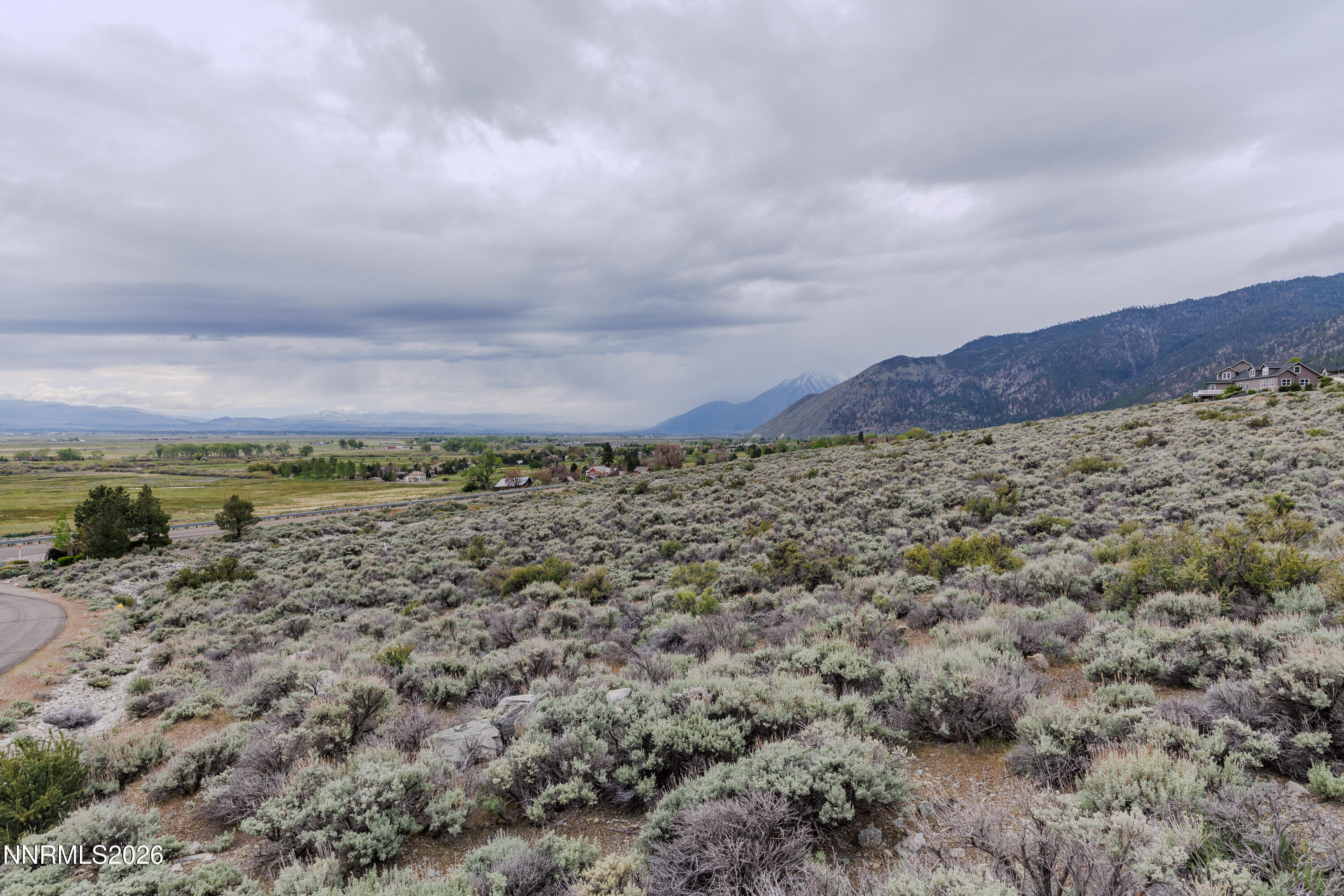 301 Adams Ranch Road Genoa, NV 89411 - Photo 18 of 25 a view of a large mountain with mountains in the background