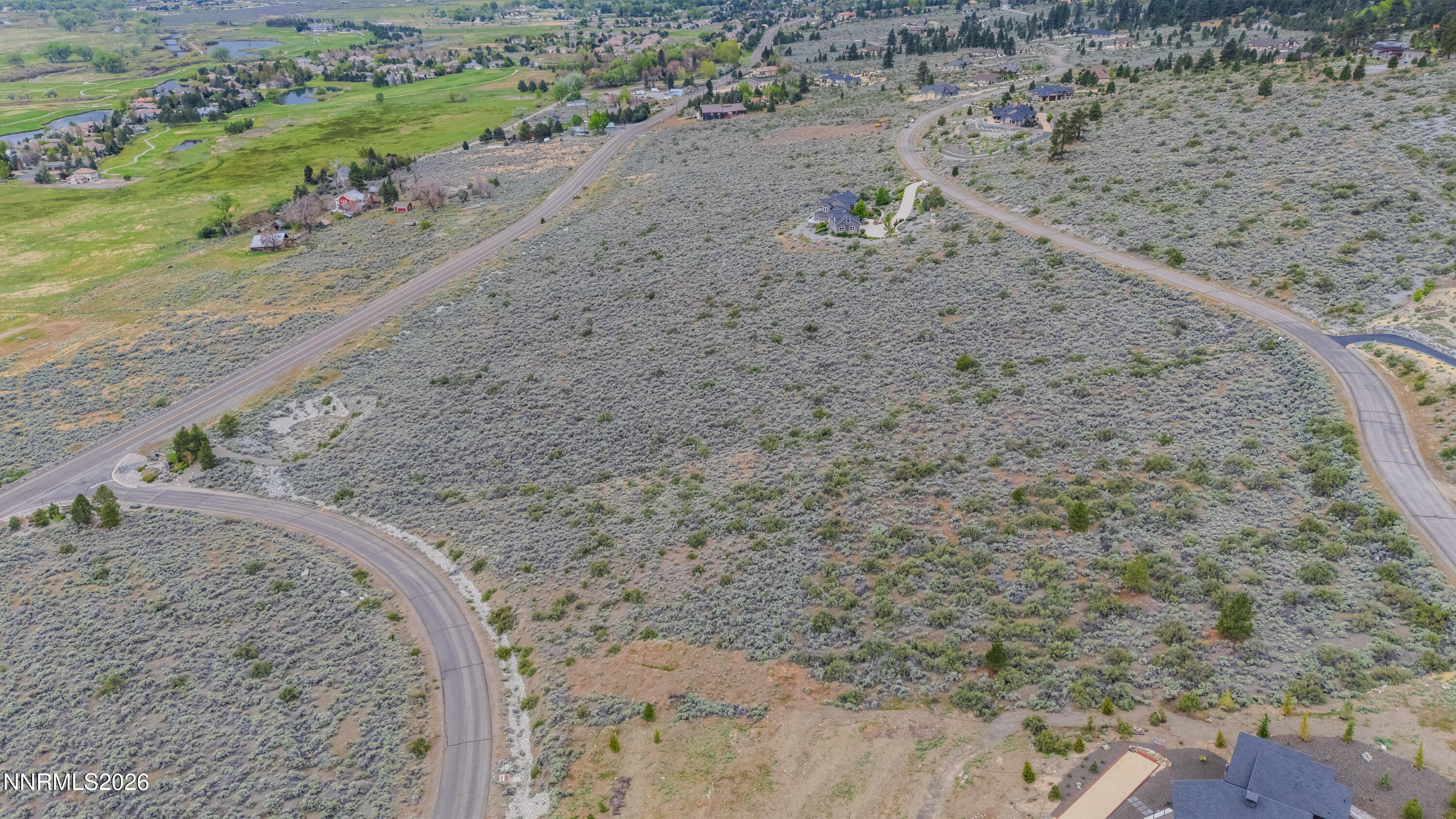 301 Adams Ranch Road Genoa, NV 89411 - Photo 2 of 25 a view of a dry yard with wooden fence