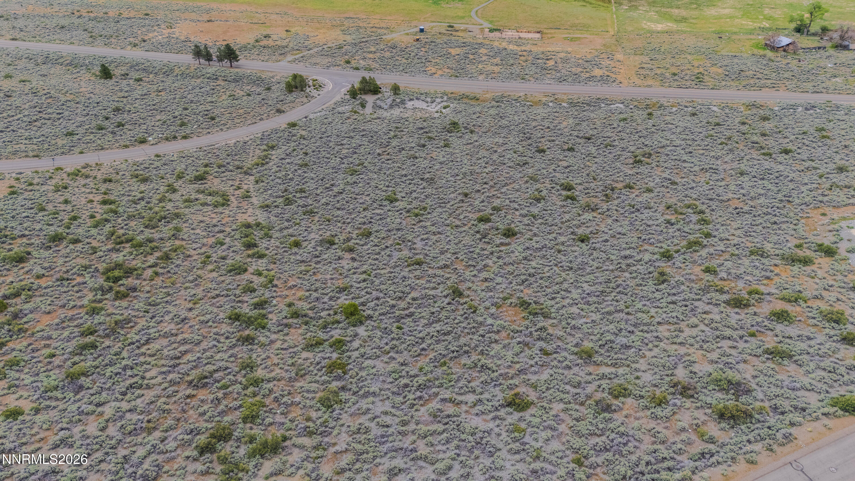 301 Adams Ranch Road Genoa, NV 89411 - Photo 3 of 25 a view of a dry yard with wooden fence