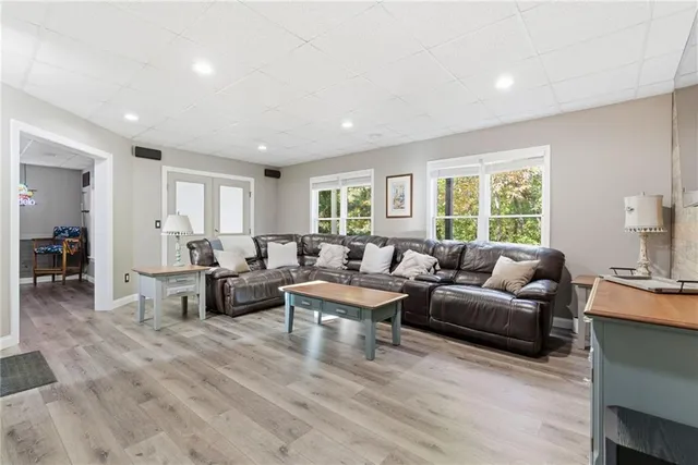 a living room with furniture and a large window