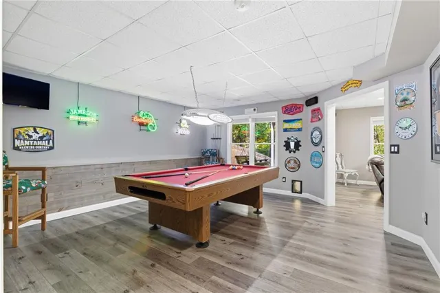 a room with furniture and view of gym equipment