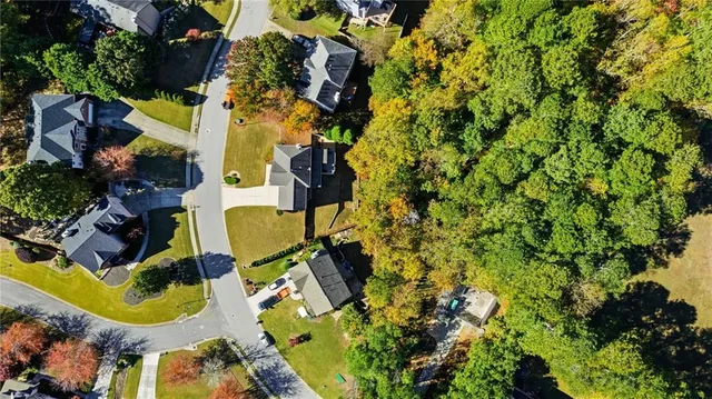 an aerial view of residential house with outdoor space and swimming pool