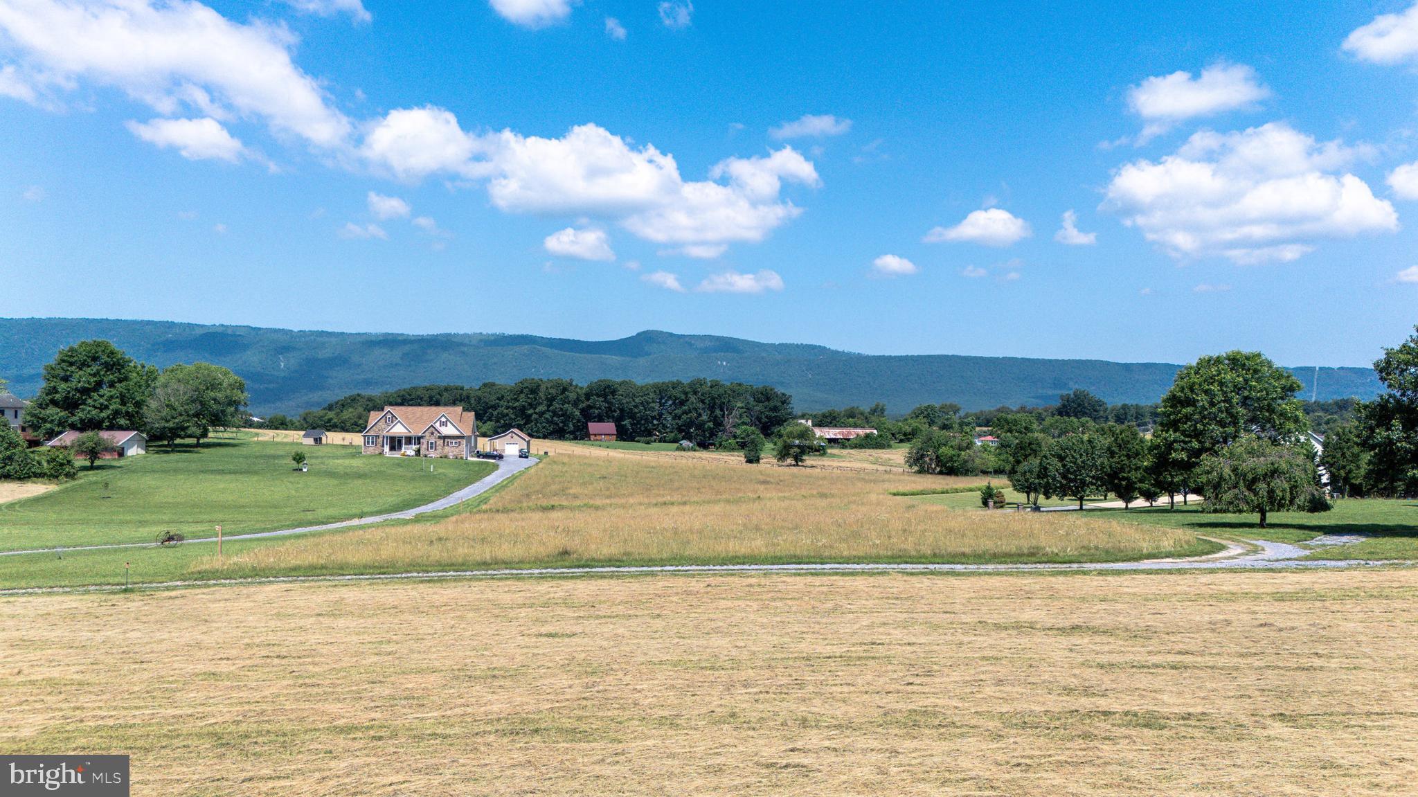 0 Cave Hill Road Luray, VA 22835 - Photo 45 of 49 a view of a lake with a house in the background