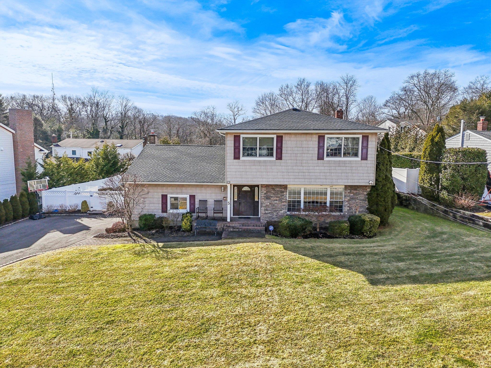 5 Pound Ridge Road Plainview, NY 11803 - Photo 1 of 1 a view of a house with swimming pool and a yard
