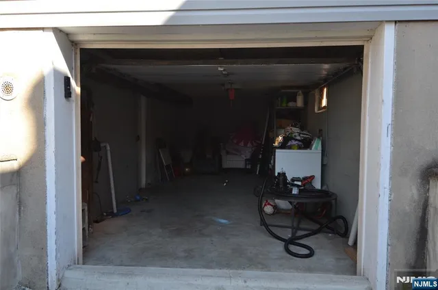 a living room with furniture and a mirror